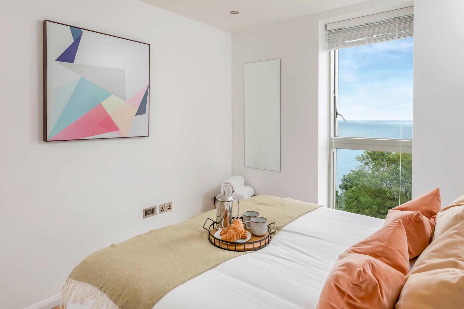 The bedroom is spacious with plenty of space for holiday clothes.