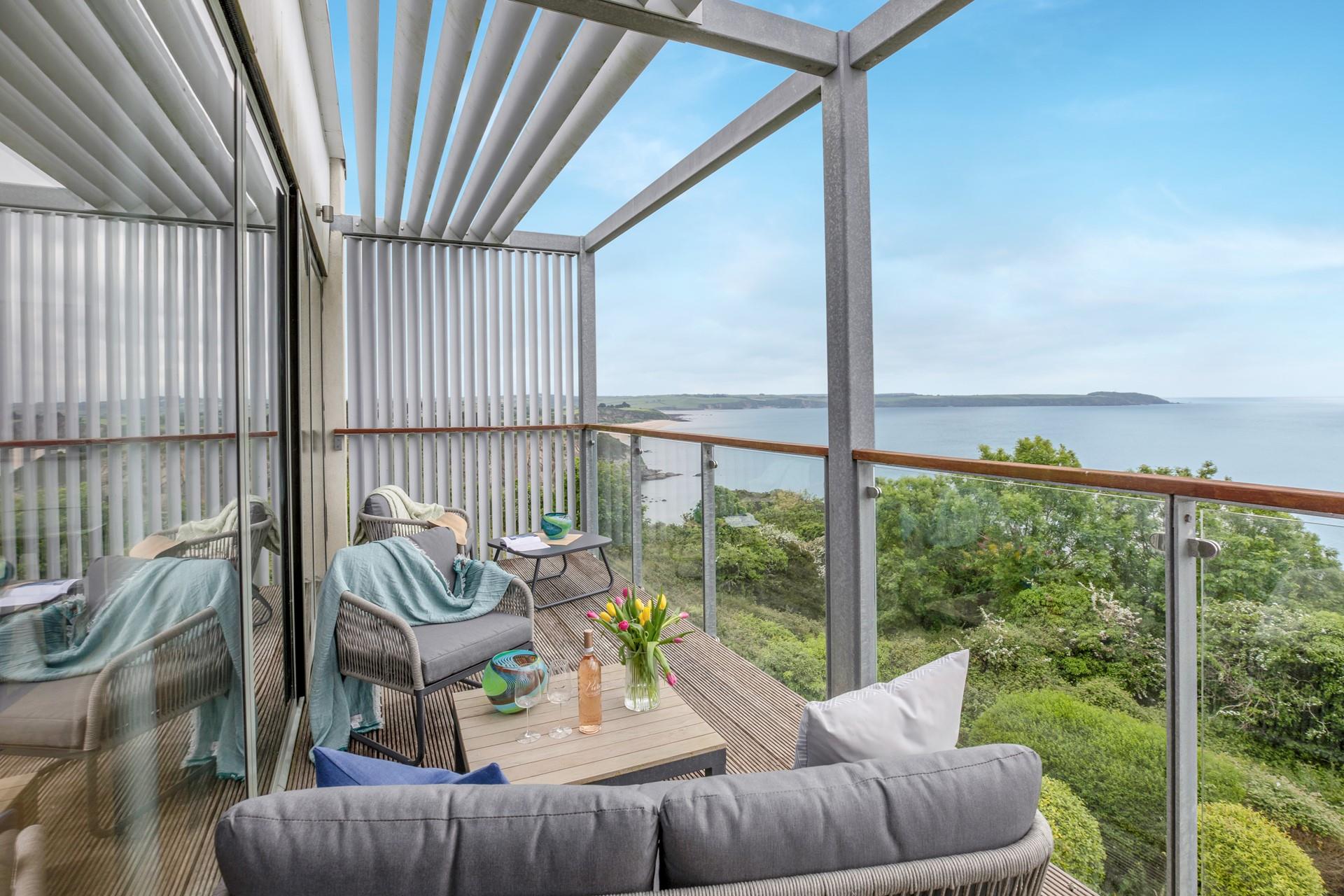 The balcony offers stunning views and a place to relax and unwind.