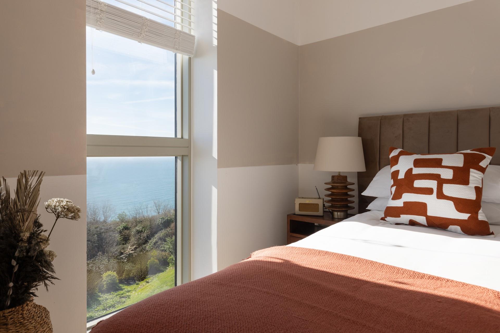 Wake up to sea views in the bedroom.