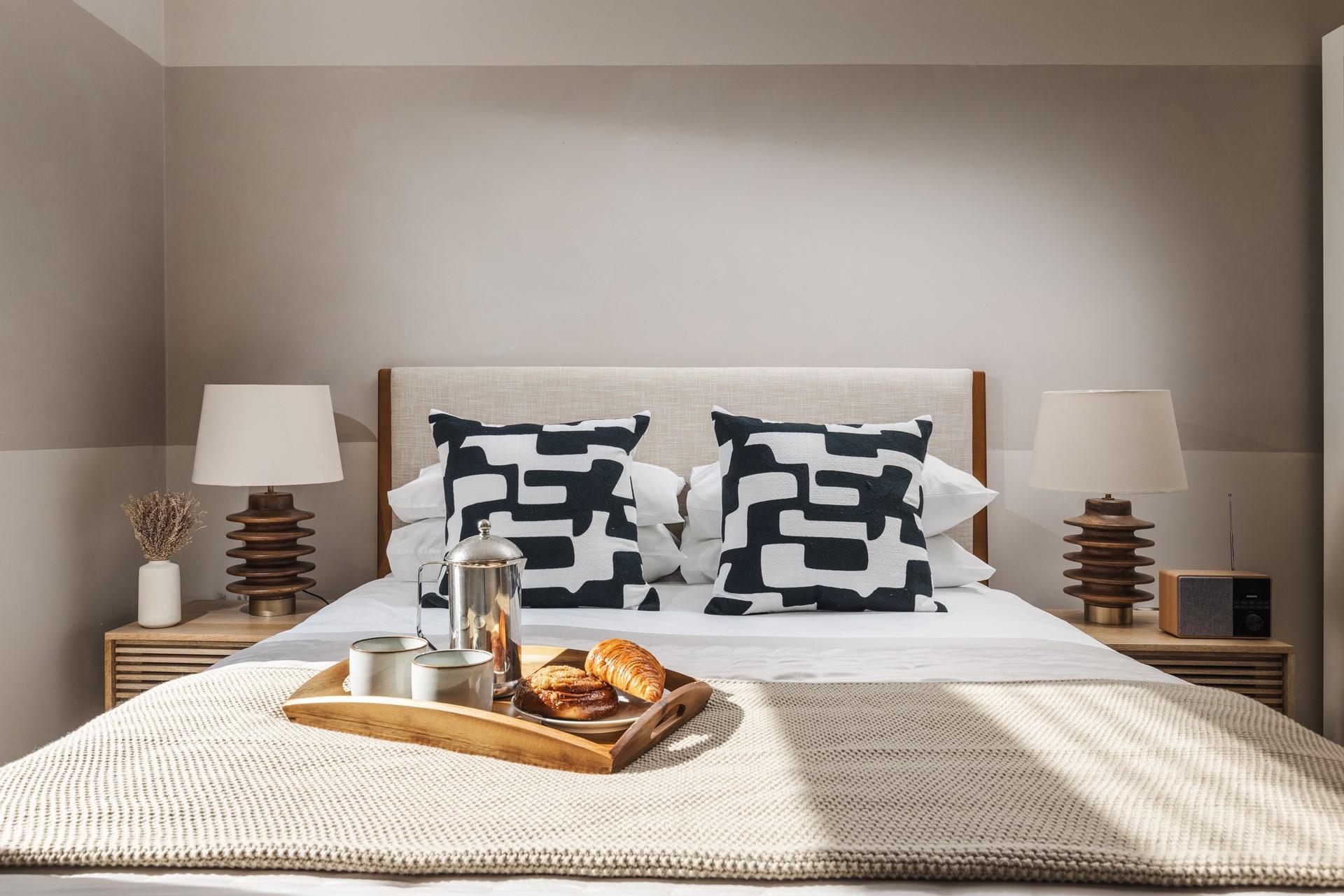 Bedroom 2 has calming neutral tones.