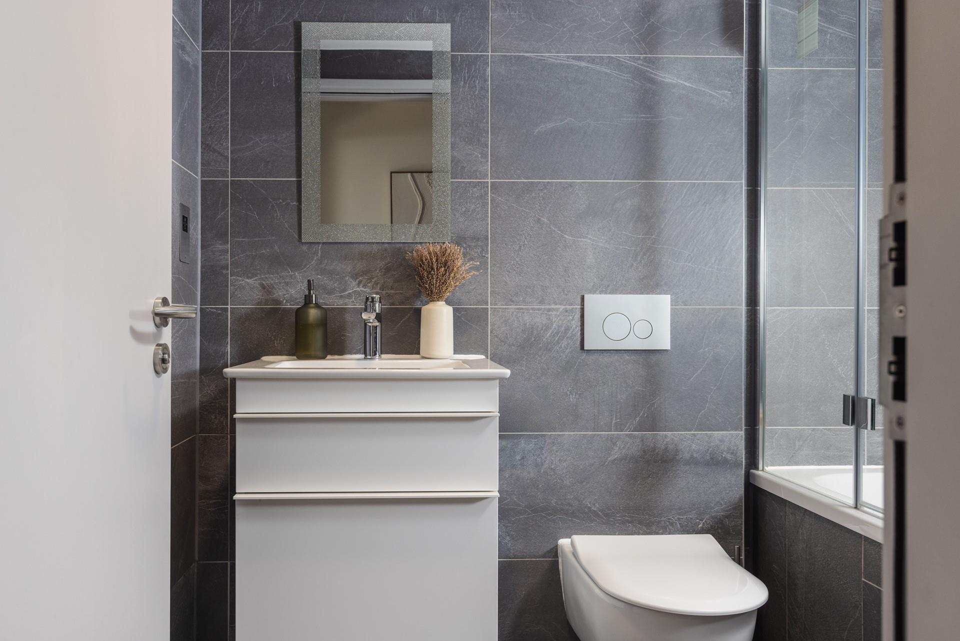 The bathroom is modern and spacious.