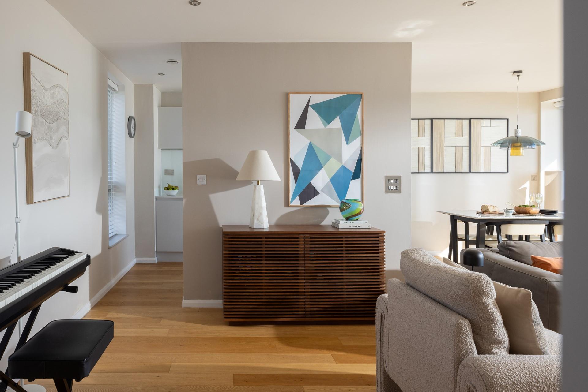 The apartment features contemporary artwork throughout.