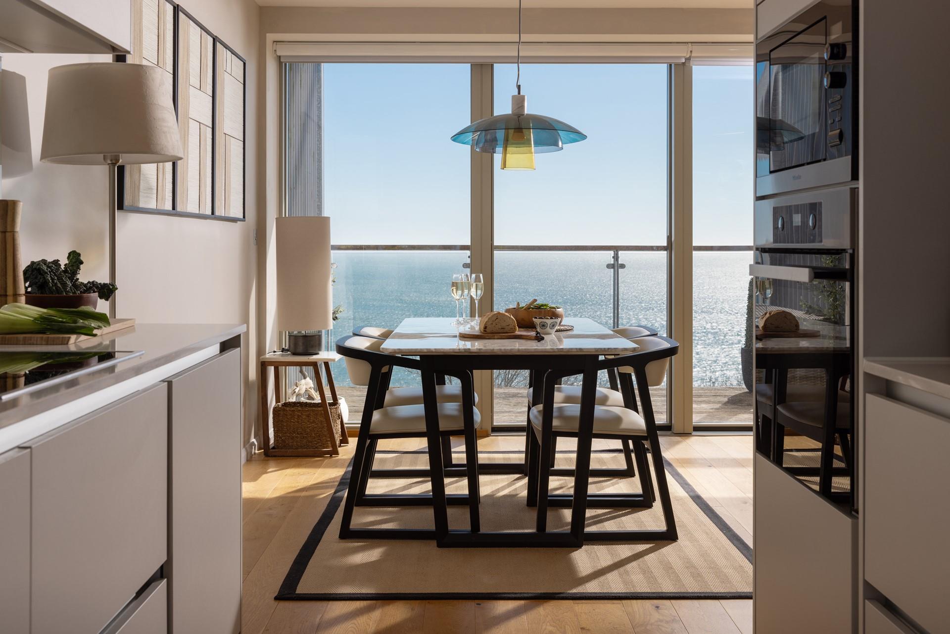 Tuck into a tasty meal with the sea view backdrop.