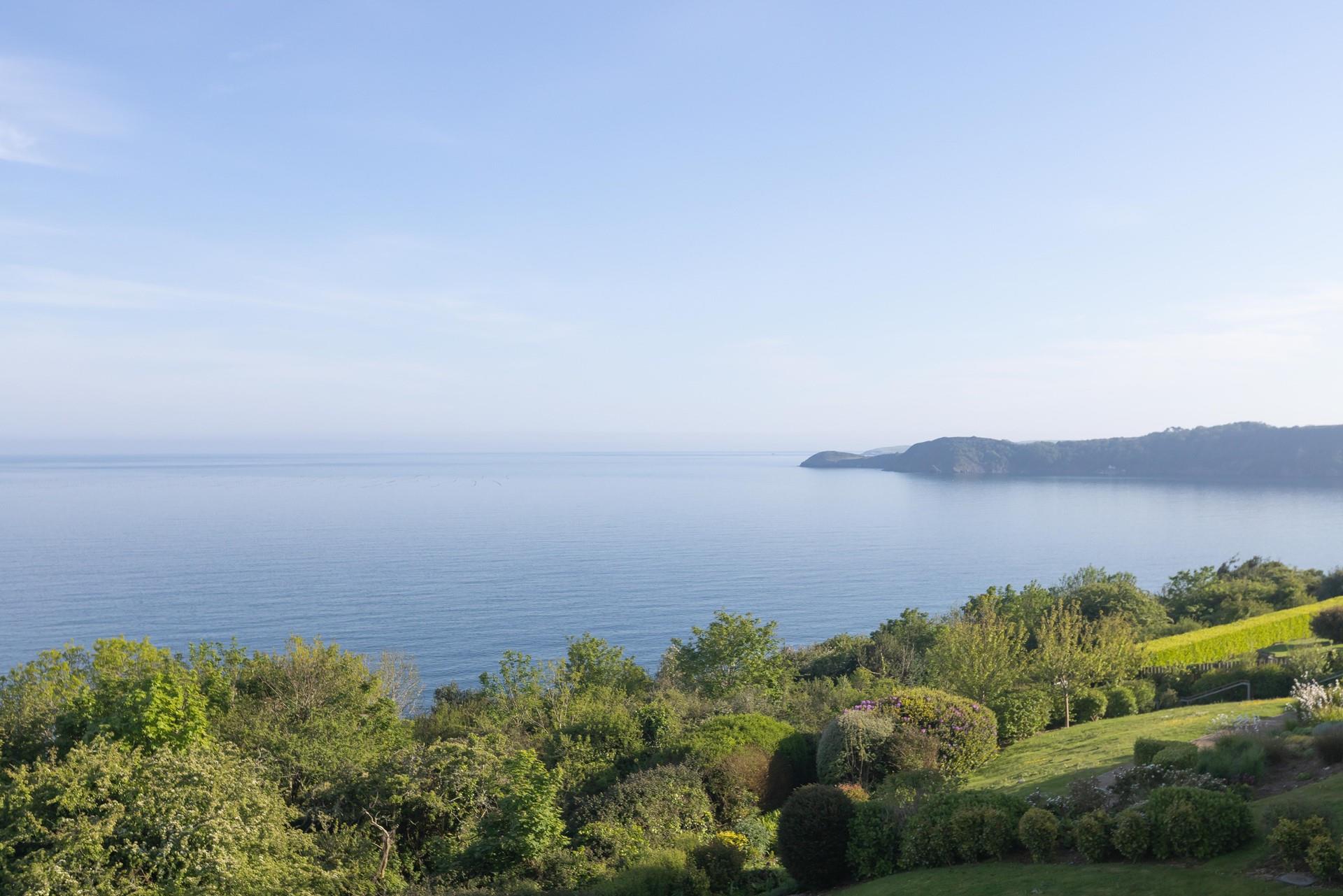 Lush green gardens line the scenic coast.