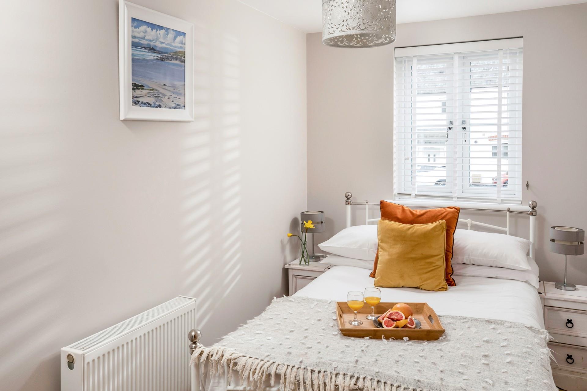 Bedroom 2 has a small double bed for additional guests.