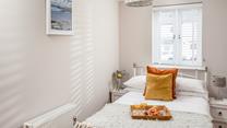 Bedroom 2 has a small double bed for additional guests.