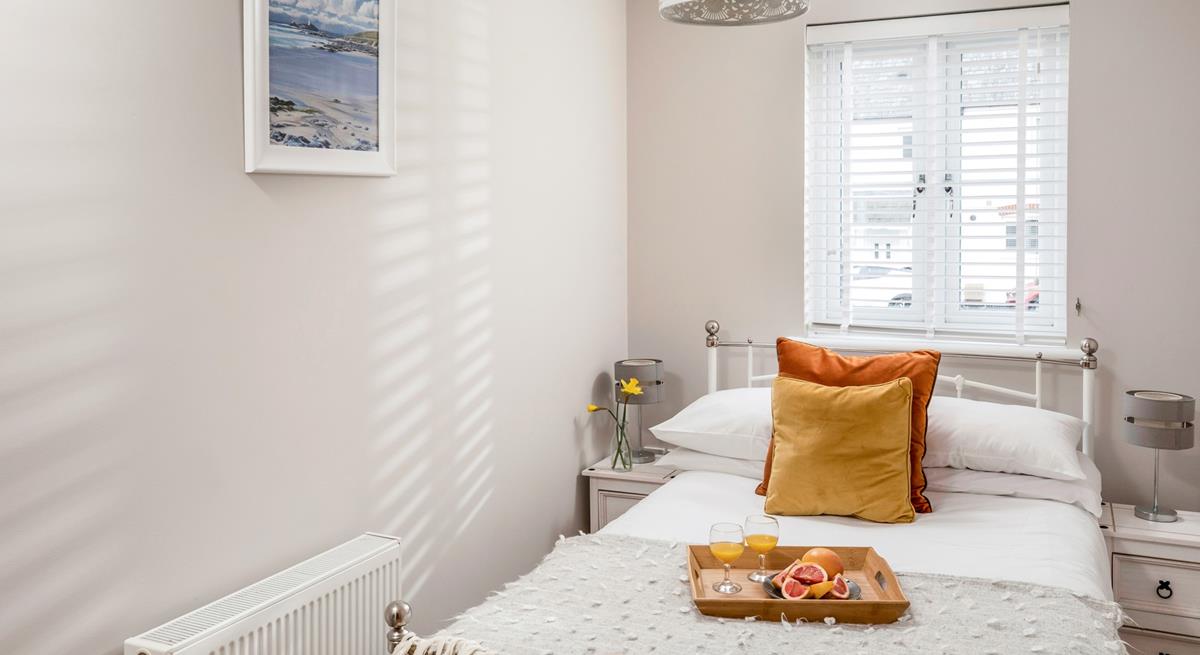 Bedroom 2 has a small double bed for additional guests.