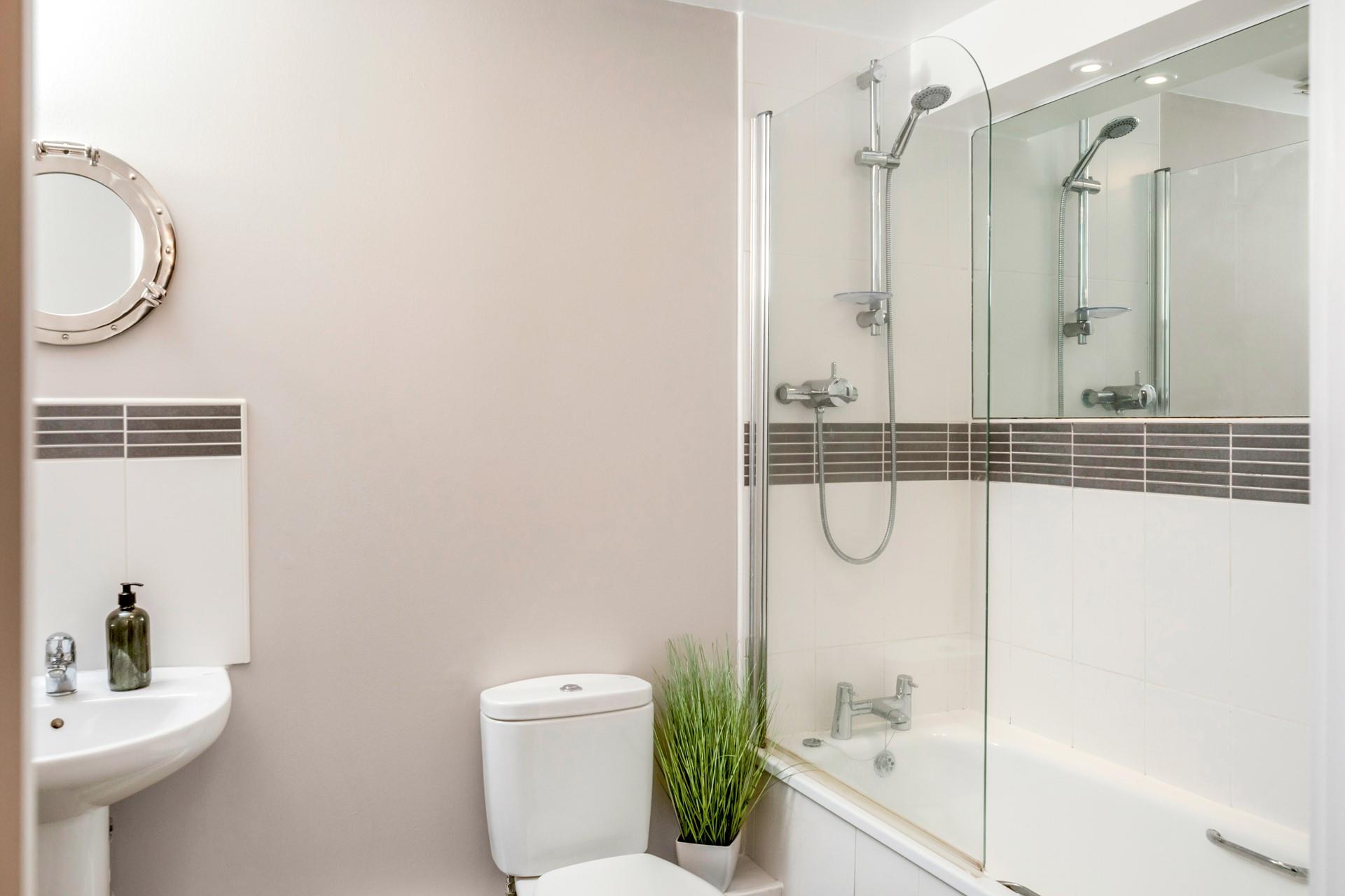 Wash off sandy toes in the shower after a day on the sand.