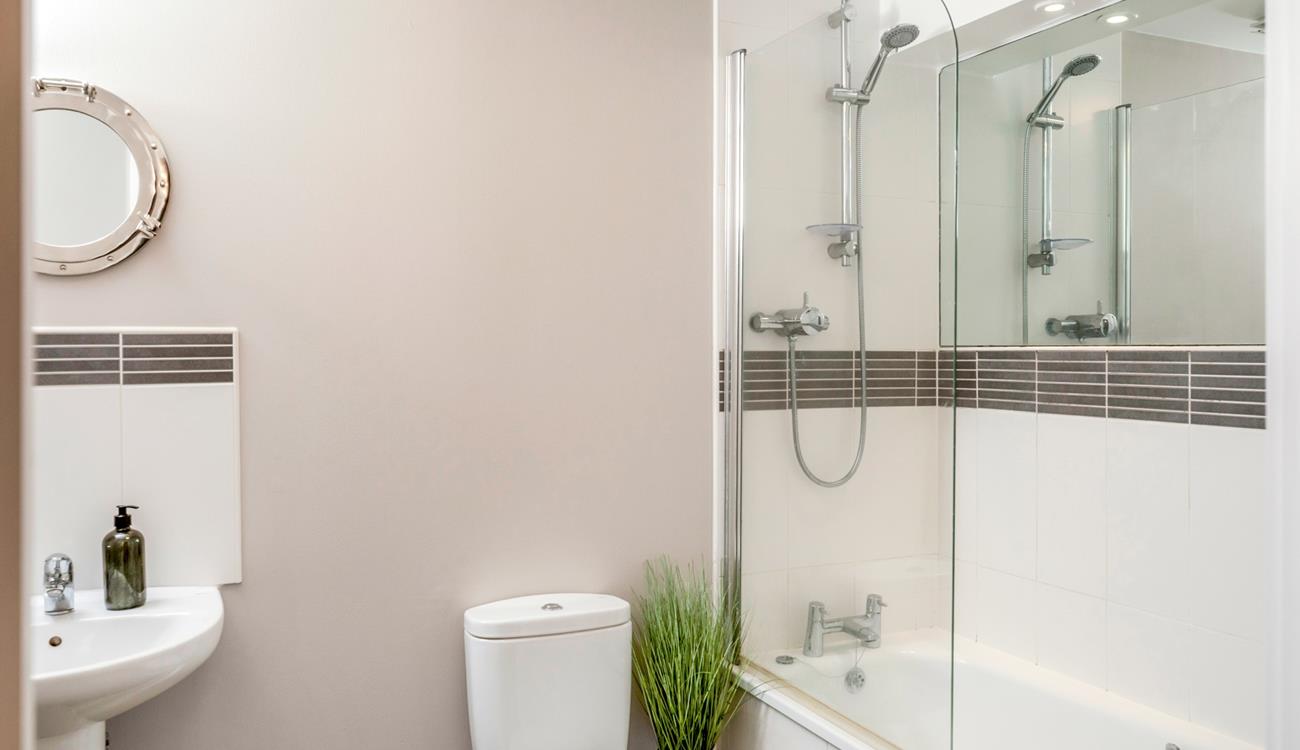 Wash off sandy toes in the shower after a day on the sand.