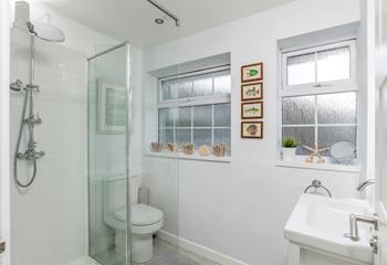 The bathroom is modern and is the perfect space to get ready in the morning.