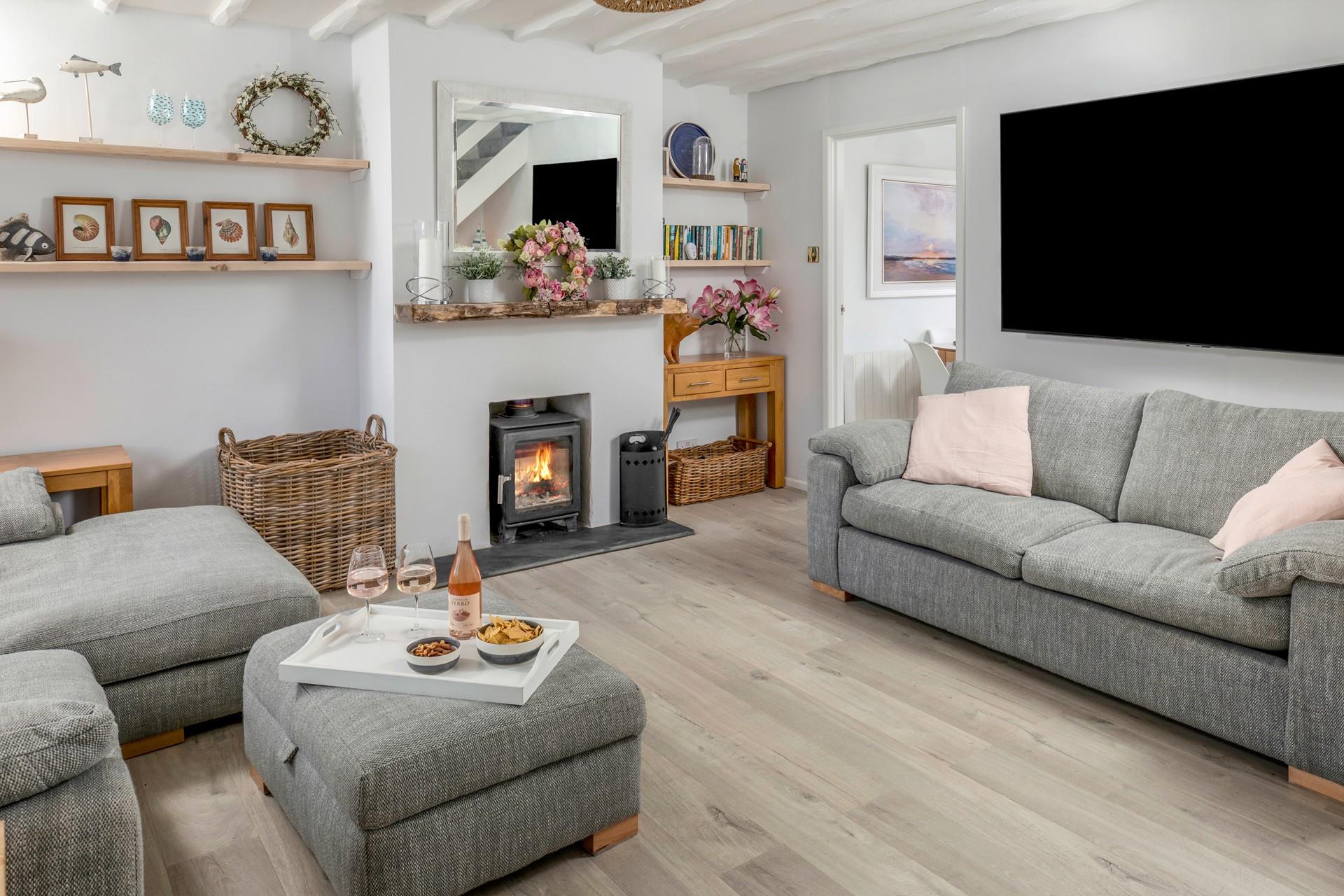 Enjoy drinks and nibbles in the cosy sitting room.