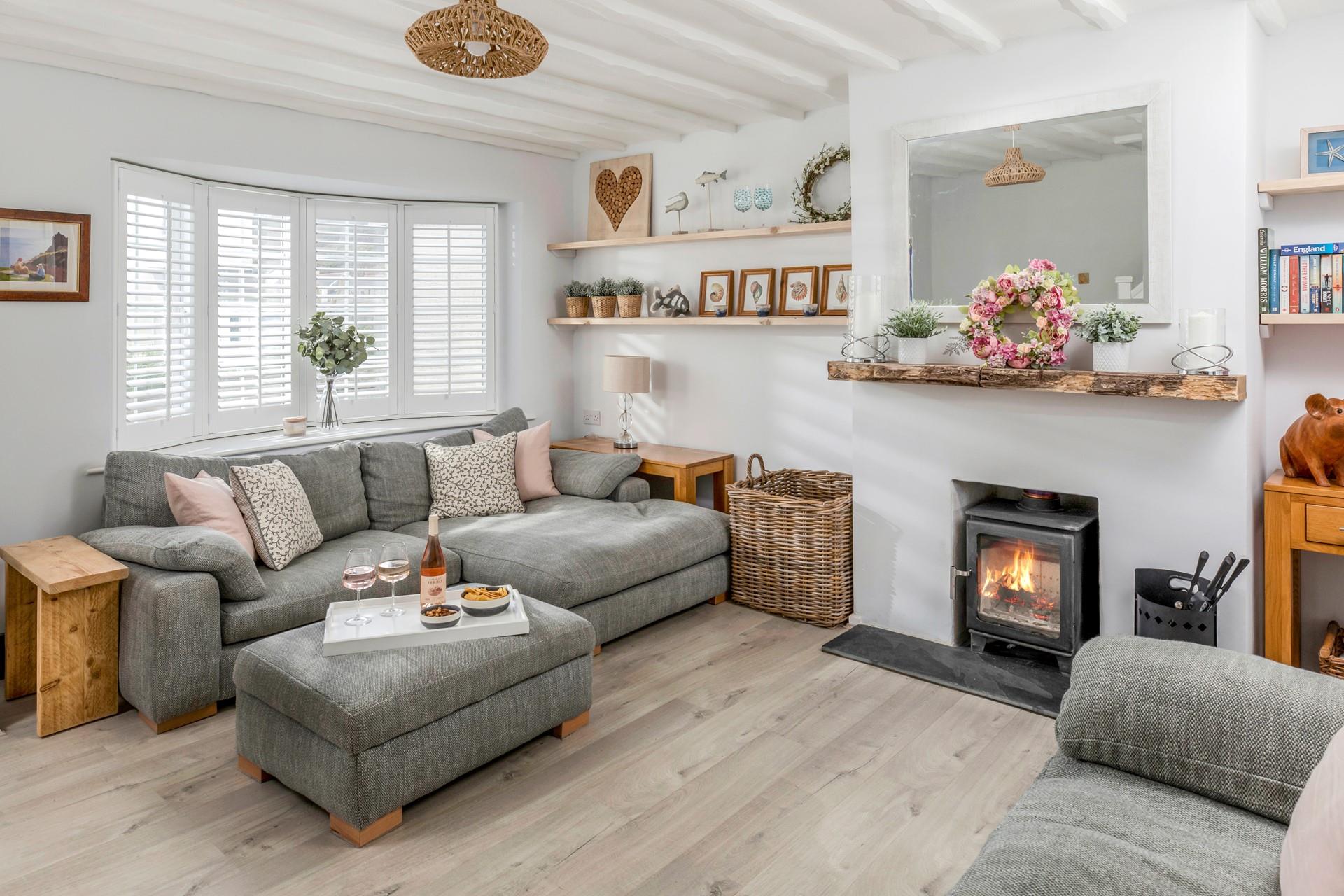 The stylishly decorated and homely sitting room offers a great space to relax.