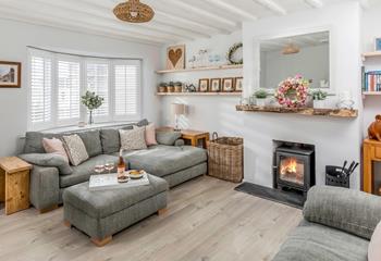 The stylishly decorated and homely sitting room offers a great space to relax.