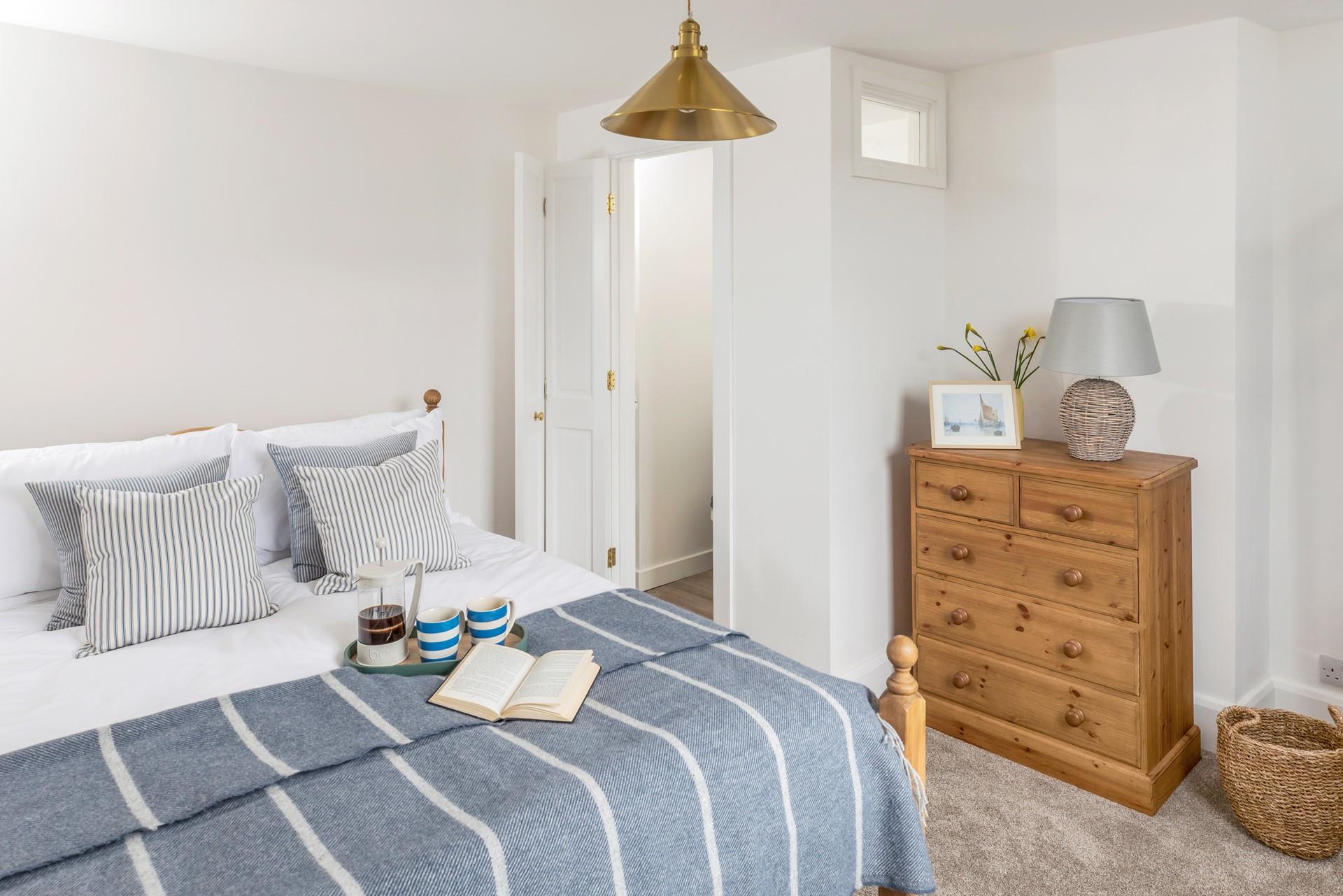 Calming blue decor features in bedroom 1.