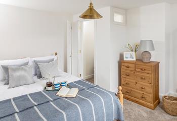 Calming blue decor features in bedroom 1.