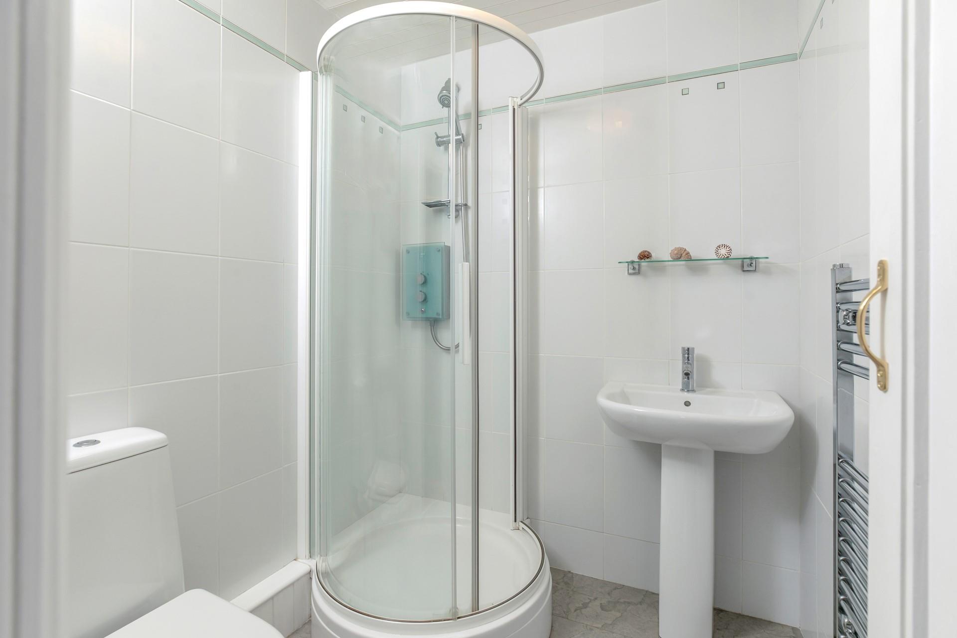 Wash off sandy toes in the shower after a day on the beach.