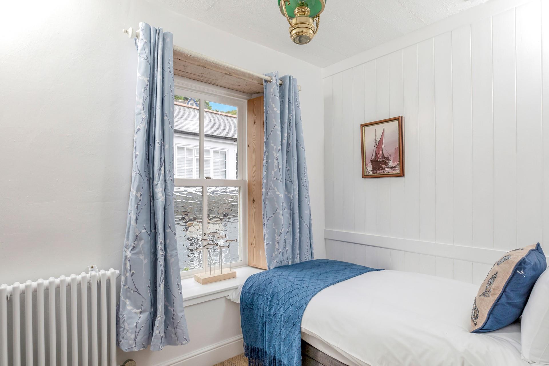 Bedroom 2 has a single bed for an additional guest.