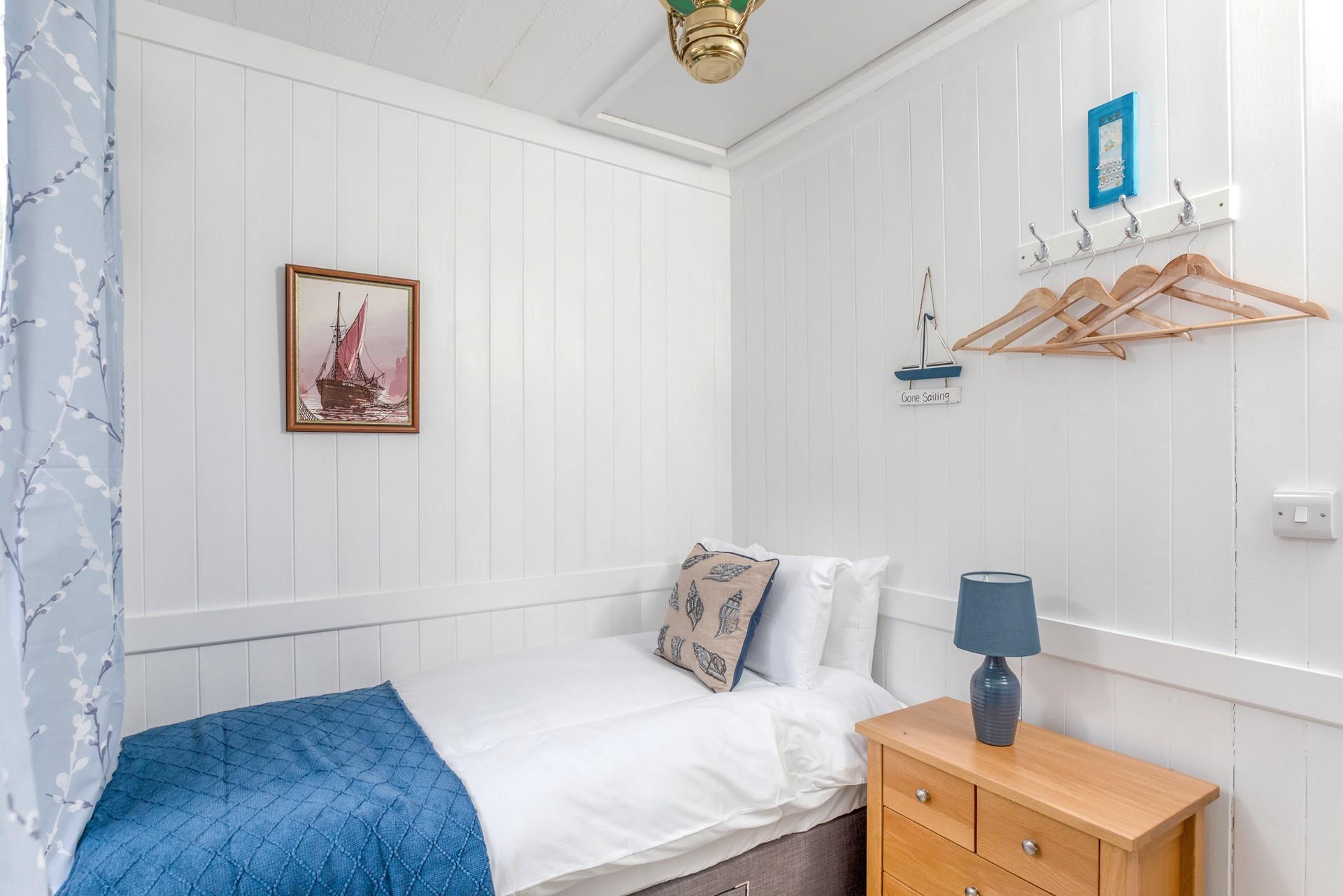 Bedroom 2 is decorated with seaside decor.