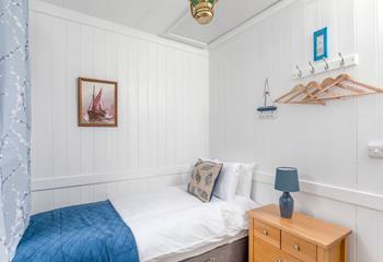 Bedroom 2 is decorated with seaside decor.