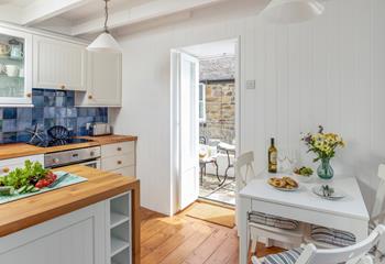 The open plan kitchen dining area leads to the courtyard for al fresco meals.