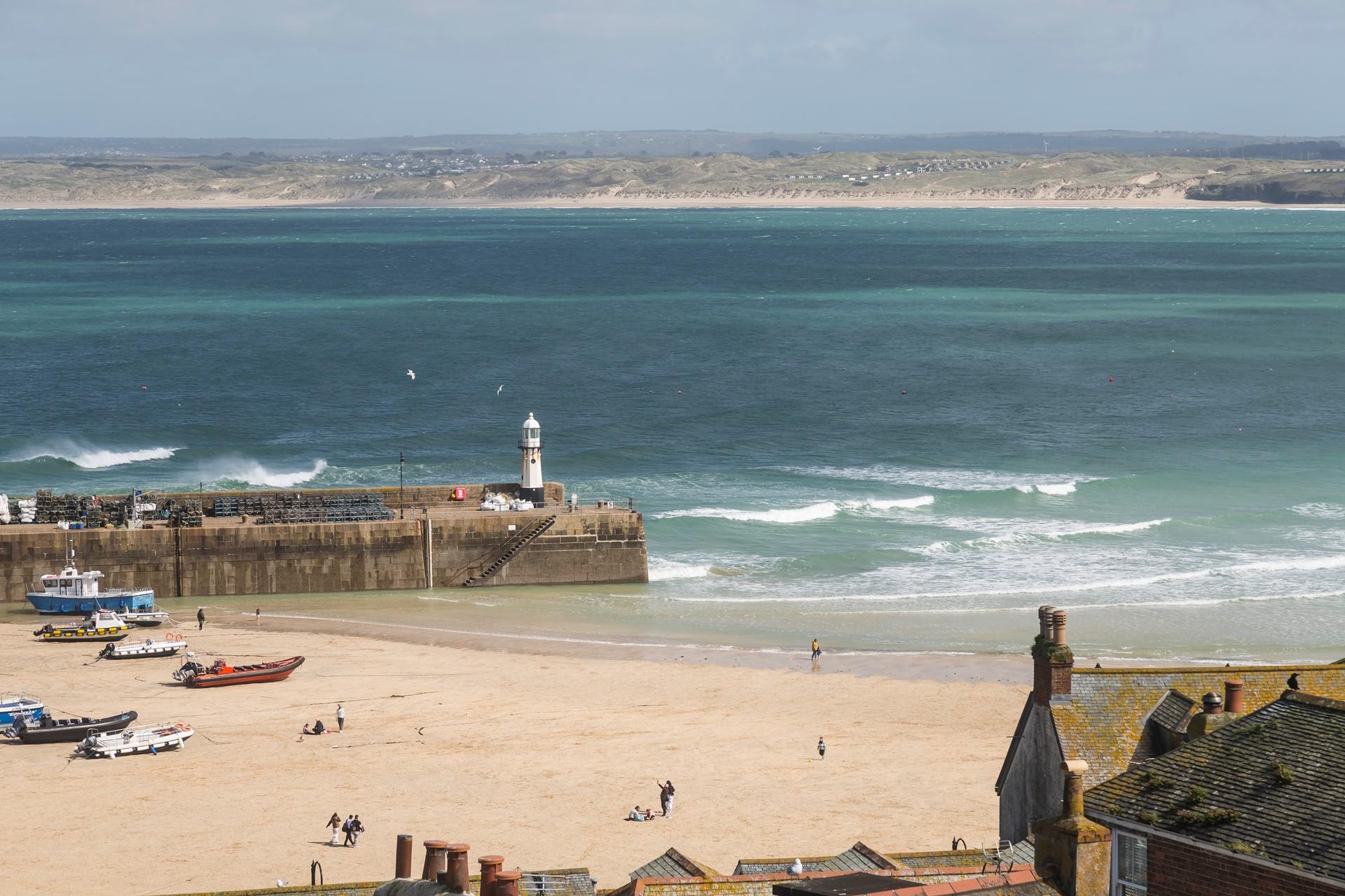 Take a morning stroll along the beach before the town wakes up.