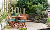 Enjoy al fresco meals out on the decking. - Thumbnail Image