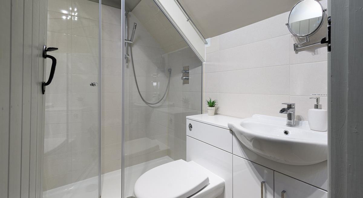 The en suite has a shower for washing off sandy toes after beach days.