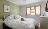 The bedrooms are decorated with calming neutral tones. - Thumbnail Image