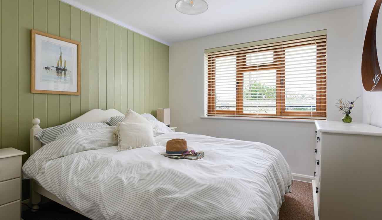 The bedrooms are decorated with calming neutral tones.