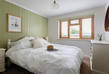 The bedrooms are decorated with calming neutral tones.