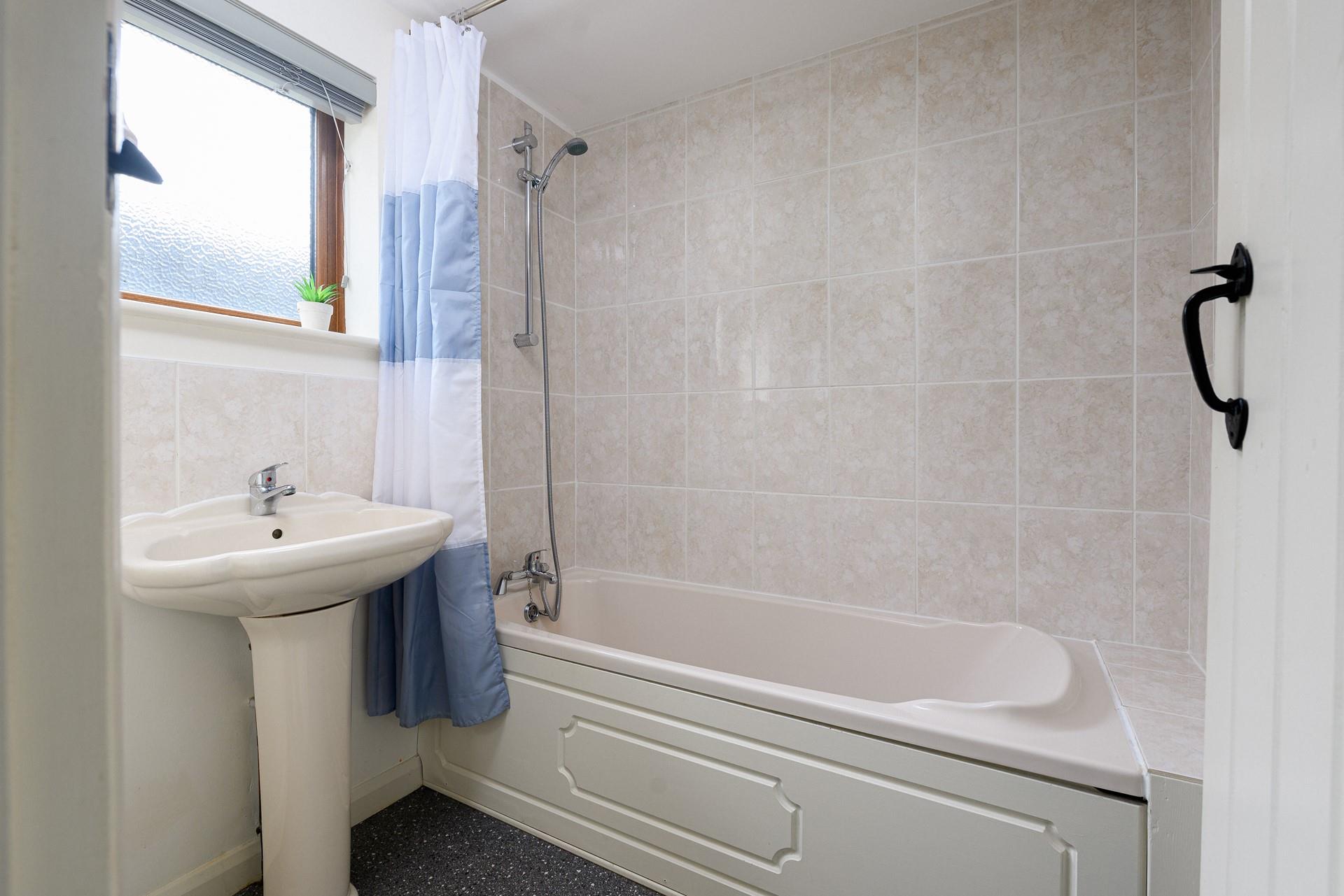 The family bathroom is perfect for a relaxing bath.