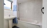 The family bathroom is perfect for a relaxing bath. - Thumbnail Image