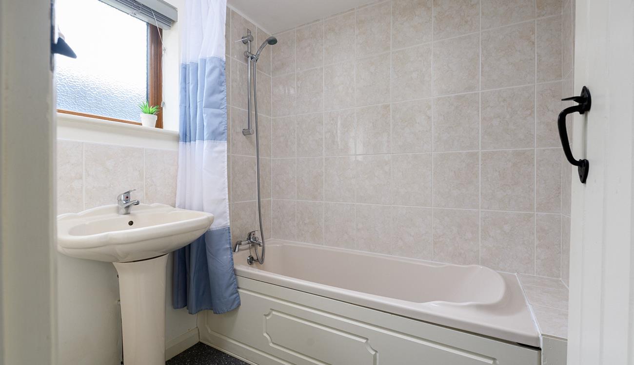 The family bathroom is perfect for a relaxing bath.