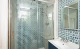 The family shower room has a delightful rainfall shower, perfect for rinsing off after a day on the sand. - Thumbnail Image