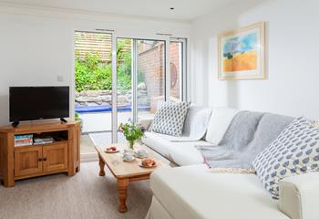 Relax in the tranquil living space, or step outside to the sunny courtyard.