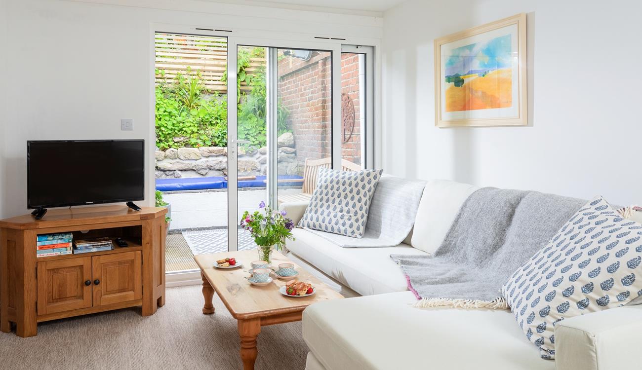 Relax in the tranquil living space, or step outside to the sunny courtyard.