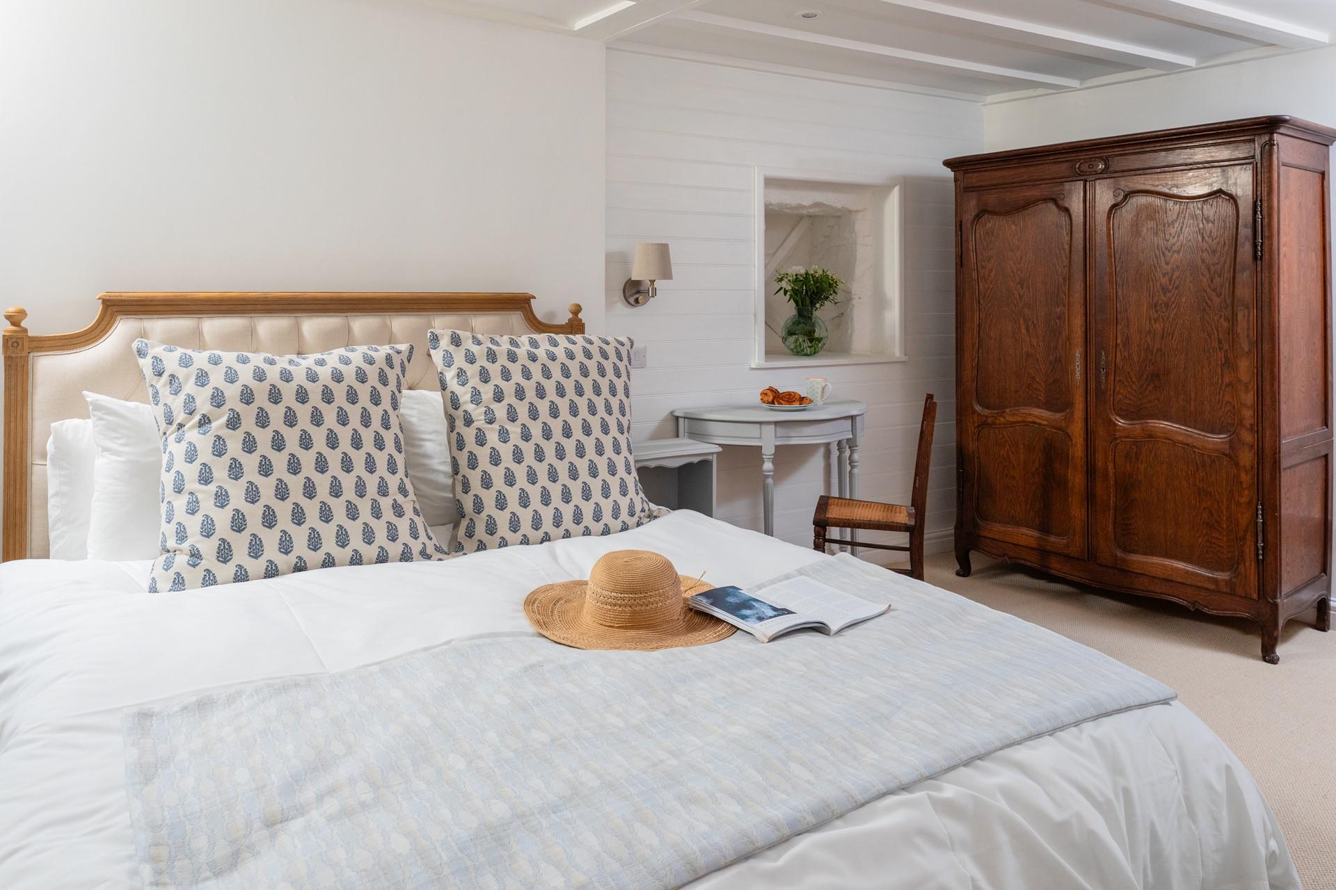 You'll drift off soundly in the classic cottage bedroom with plush mattress.