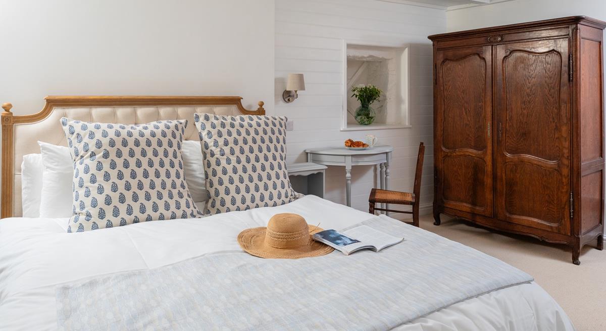 You'll drift off soundly in the classic cottage bedroom with plush mattress.
