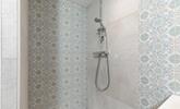 Step into the en suite shower after a day of wandering the nearby coastal paths. - Thumbnail Image