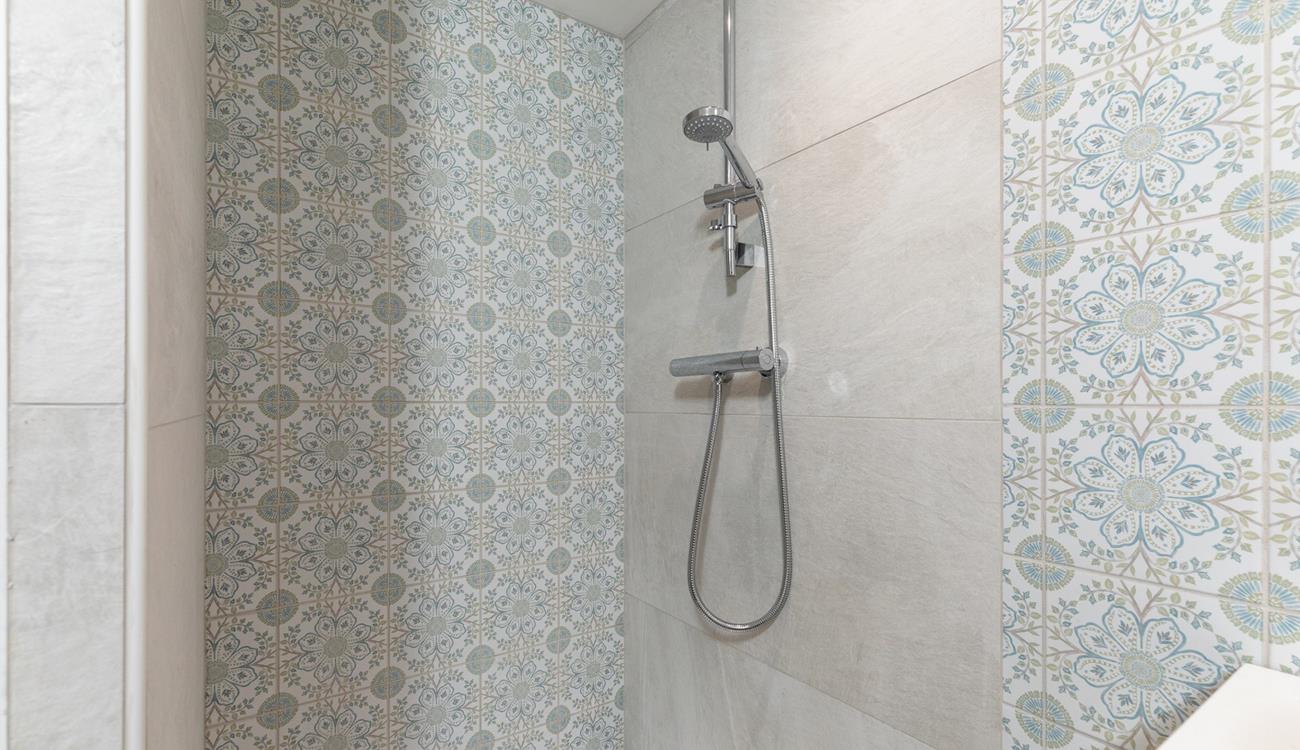 Step into the en suite shower after a day of wandering the nearby coastal paths.