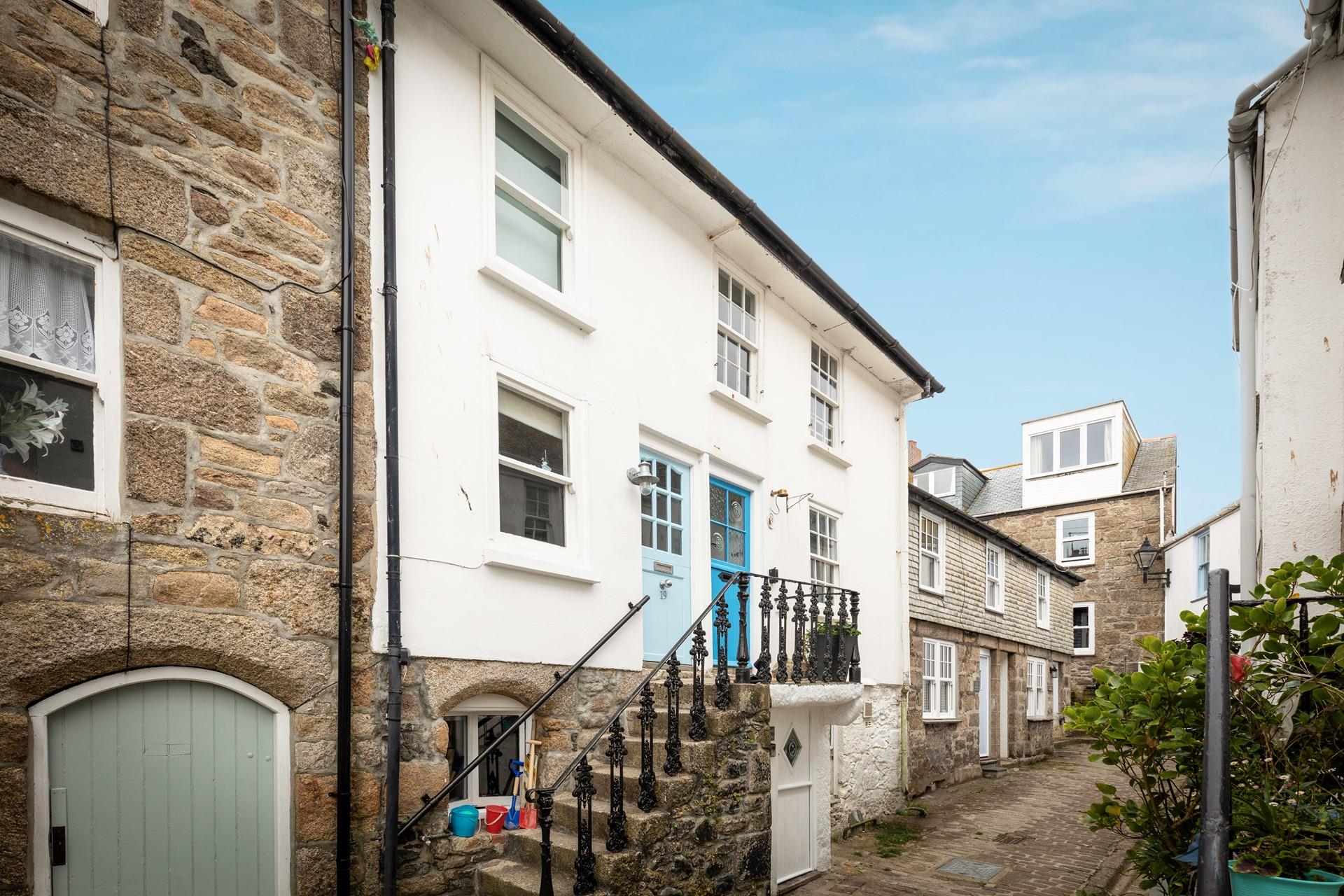 Located just behind Fore Street in a quaint lane, moments from the harbourside.