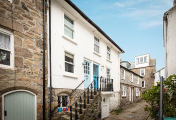 Located just behind Fore Street in a quaint lane, moments from the harbourside.