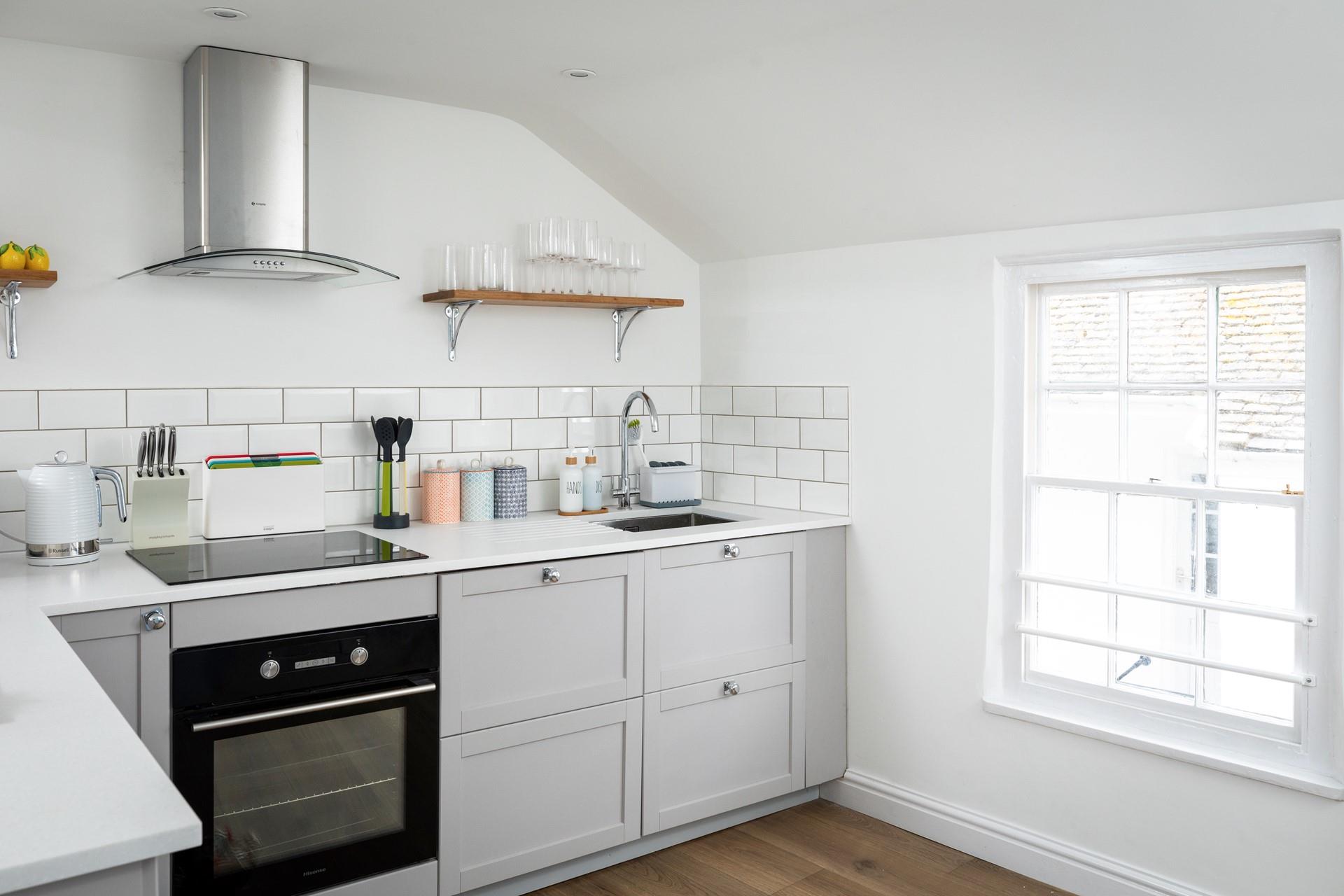 The modern kitchen is compact, but has all you need.