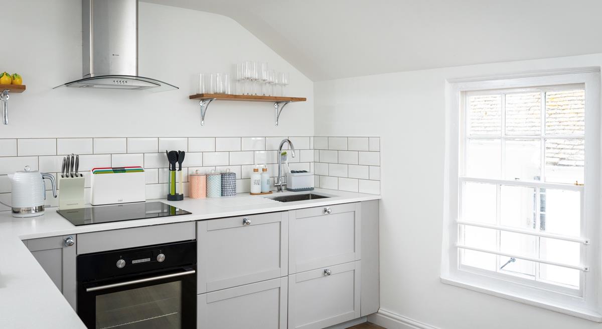 The modern kitchen is compact, but has all you need.