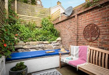 The quaint courtyard is a private suntrap.