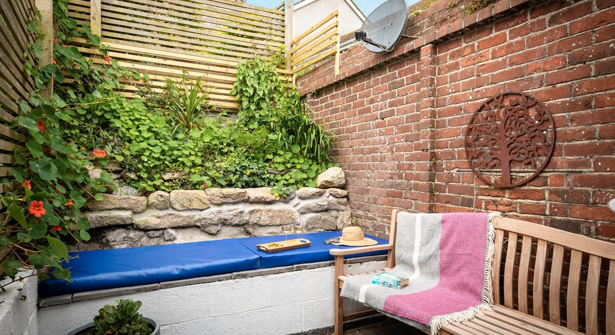 The quaint courtyard is a private suntrap.