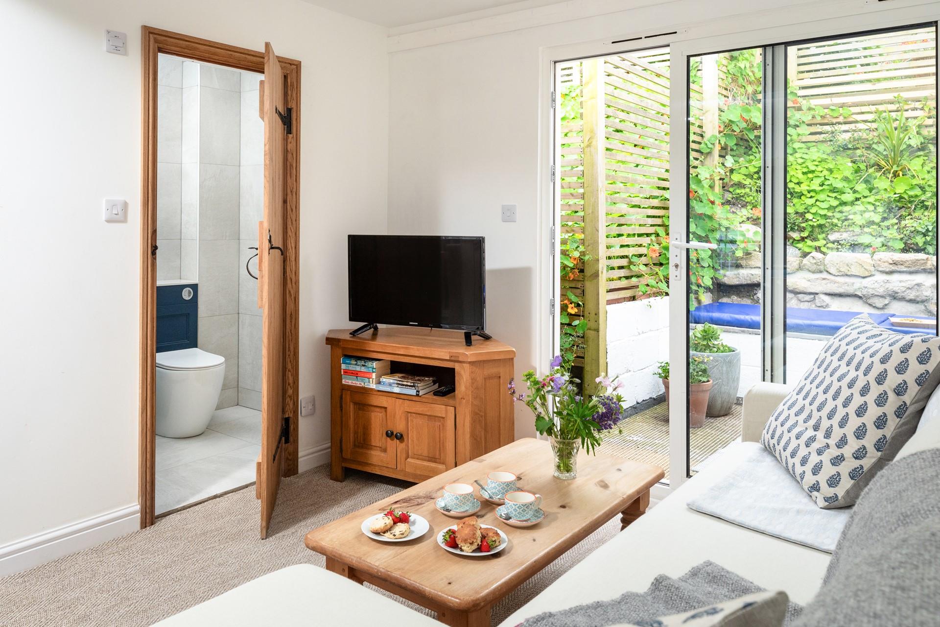 The cosy lounge is light and airy, where you can curl up after a busy day on the beach.