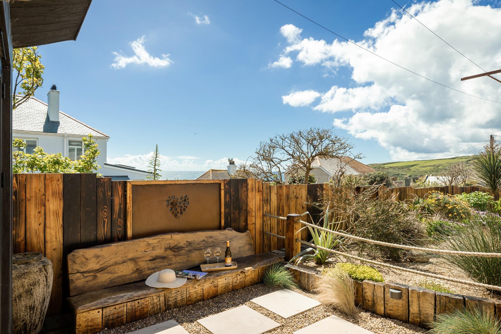 The garden offers a sea view and is the perfect spot for dining in the summer months.