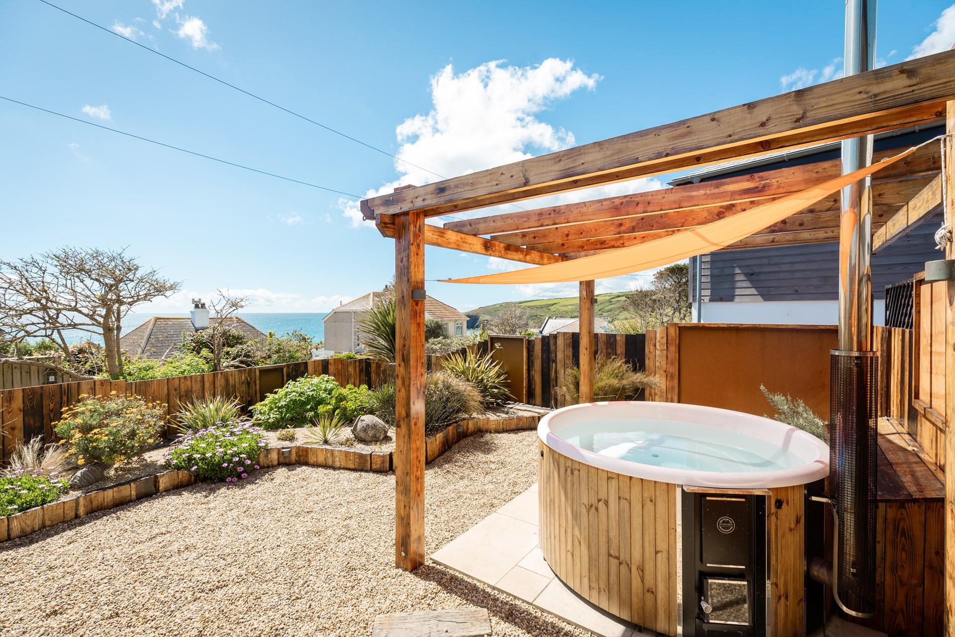Take a dip in the hot tub on a sunny afternoon and soak up the sun.