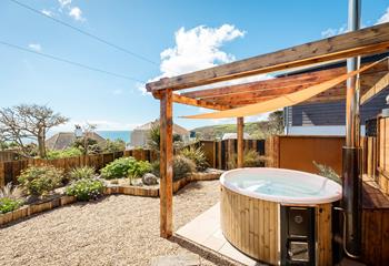 Take a dip in the hot tub on a sunny afternoon and soak up the sun.